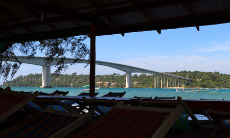 Tropical seascape with a high concrete bridge to an islandの写真素材