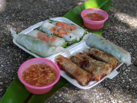 Vietnamese spring rolls with lettuce, mint, shrimp and vermicelli (Cha gio) fresh and deep fried...