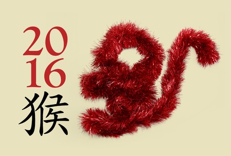 New year greeting card with chinese "monkey" hieroglyph and tinsel shaping monkeyの写真素材
