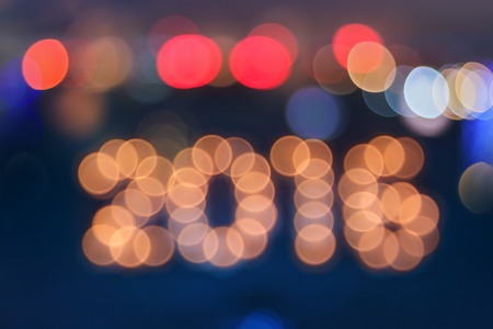 new year greeting card made of colorful bokeh digits in shape of 2016の写真素材