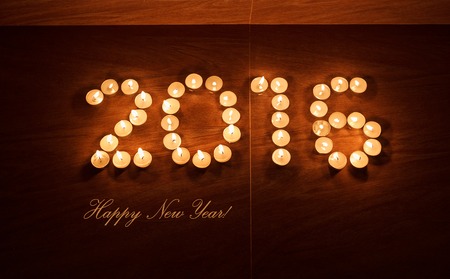 xmas evening tea light candles glowing in the night in form of 2016 new year, horizontal top viewの写真素材