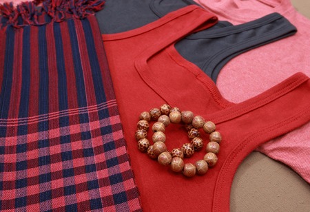 Colorful shirts and traditional khmer scarfs and buddish beads perspective viewの写真素材