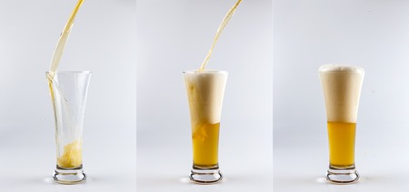 Set of three beer glasses against white background. Filling glasses with beer sequence.の写真素材