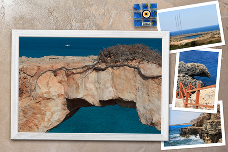 Beautiful snapshots of various Cyprus landscapes in wooden frames arranged on rustic background, with copy space, horizontal top view.の写真素材