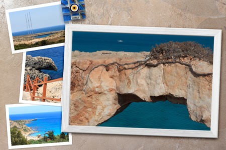 Beautiful snapshots of various Cyprus landscapes in wooden frames arranged on rustic background, with copy space, horizontal top view.