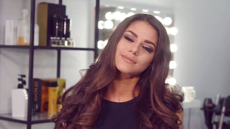Portrait of a beautiful European woman smiling at the beauty salon, real people series.
