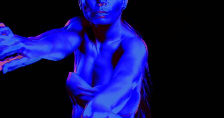 close up Oriental dance on a black background a girl with a slender body in a psychedelic dream