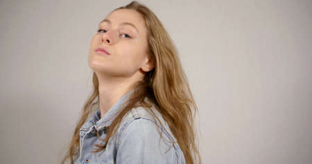 woman poses in front of camera taking part in photoshootの写真素材