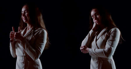 two women with long dark hair, dressed in formal light dresses. they slowly rotate on a black...
