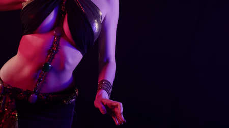 sexy female body of woman dancing belly dance, slim waist and big breastsの写真素材