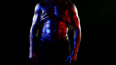 erotic fantasy, sexual male torso covered shiny dye, female hands are stroking himの写真素材