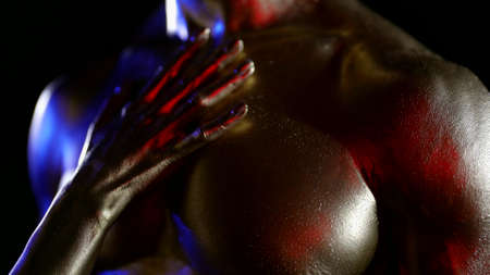 sensual enjoyment during preliminary caress, woman is stroking body of brawny sexy man, closeupの写真素材