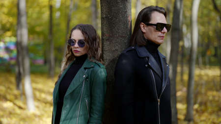 misunderstanding and breakup of loving couple, woman is walking away from her boyfriendの写真素材