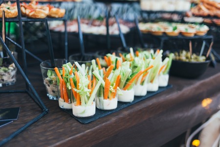 A beautiful banquet table with snacks on the tableの写真素材