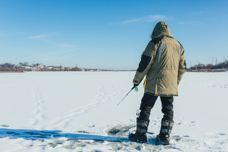 Ice fishing. Winter fishing rod and equipmentの写真素材