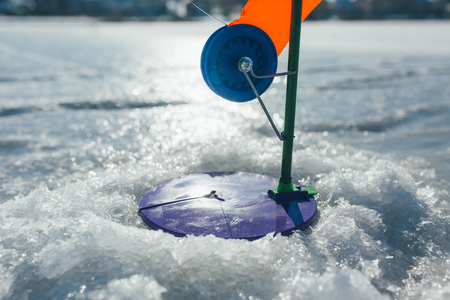 winter fishing, fisherman snow frozen ice sportの写真素材