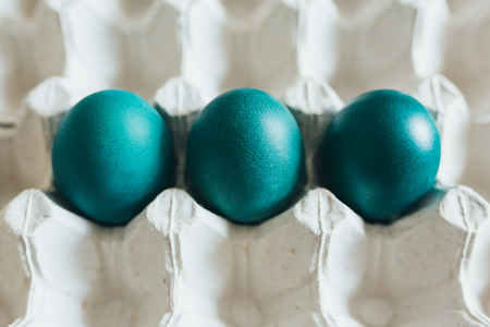 Chicken easter eggs in a cardboard trayの写真素材