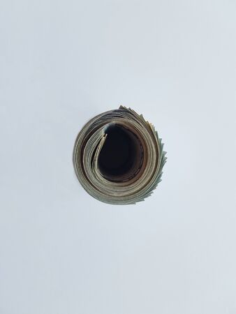 The dollars are in the tube. Background with copyspaceの写真素材