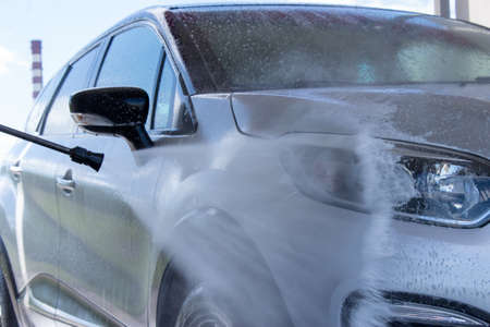 Grodno, Belarus - 01/06/2020: Washing a silver Renault Kaptur car on the first day of summer. The output from the isolation of coronavirusのeditorial素材
