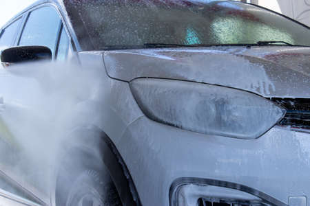 Grodno, Belarus - 01/06/2020: Washing a silver Renault Kaptur car on the first day of summer. The output from the isolation of coronavirusのeditorial素材