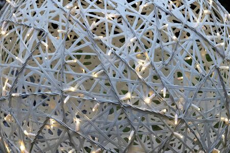 White Christmas ball with light bulbs close up
