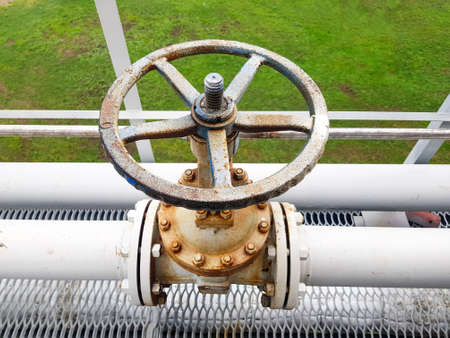 Closing or opening for gas or water supply through a pipeline. Shut-off valves on the pipeline close-upの写真素材