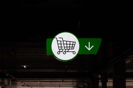 A shopping cart sign in the supermarket parking lot. Cart sign close-upの写真素材