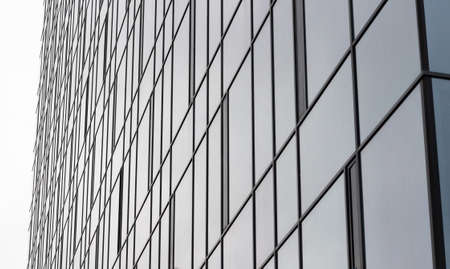View of a modern glass skyscraper. Glass skyscraper close-up