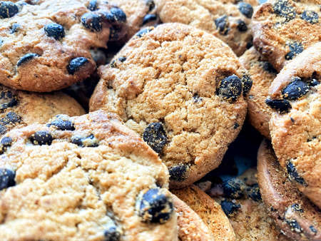 Background of oatmeal cookies with chocolate pieces. Oatmeal cookies close-upの写真素材
