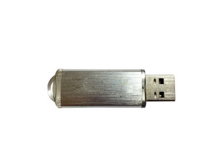 Silver flash drive close-up on a white isolated background. A USB flash drive is a storage device...