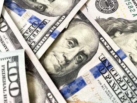 Background of hundred-dollar bills. The texture of hundred-dollar bills. A lot of dollarsの写真素材