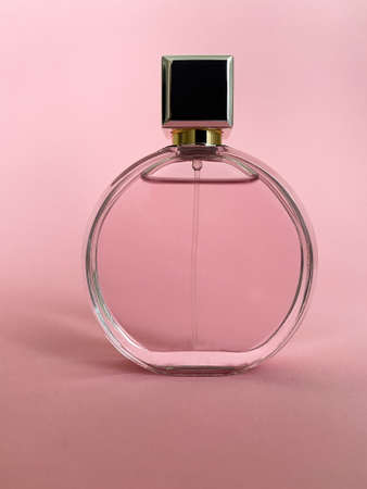Perfume bottle from a pink box on an isolated background with mockup and copyspaceの写真素材