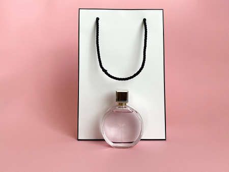 Perfume bottle from a pink box on an isolated background with mockup and copyspaceの写真素材