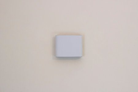 LED wall lamp close-up. Modern minimalistic bedside lamp for the bedroomの写真素材