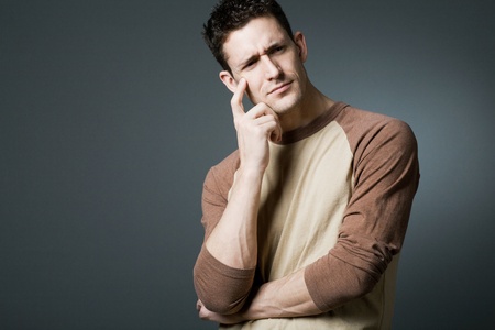 Young handsome man resolving a problem.