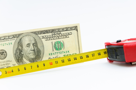 Measurement of a dollar banknote face value in hundred dollars. Roulette and money. Money for design and construction. Budget of repair.の写真素材