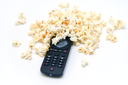 TV remote and popcorn. Watching TV concept.の写真素材