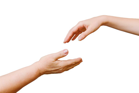 Interaction of generations. Hands of the young and old woman. Daughter and mother.
