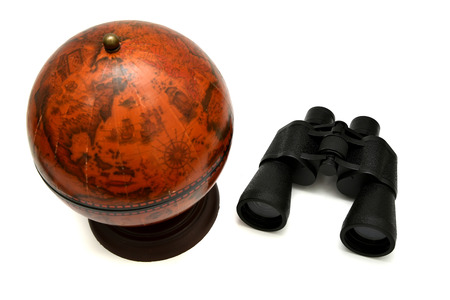Binoculars and vintage globe on a white background. Articles of traveller.の写真素材
