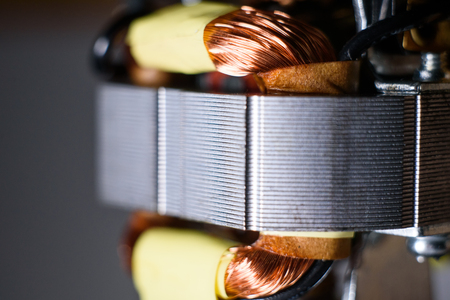 Electric motor rotor and copper winding macro. Technological electric motor close up.