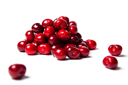 Heap of ripe fresh red cherry food on a white background isolatedの写真素材