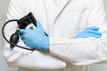 Cardiologist doctor holds the pressure test device, tonometer in handの写真素材