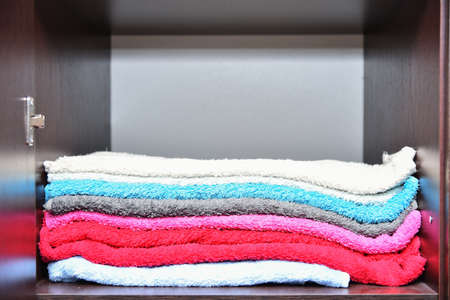 Towels is soft folded in hotel shelf closetの写真素材