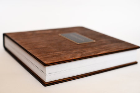 Big book with wooden cover of photo album, small depth of field.の写真素材