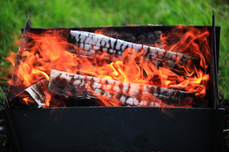 Firewood is burning in grill. Great fire.の写真素材