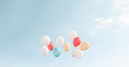 Bunch of multicolored balloons floats gracefully against clear sky. Cheerful hues bring sense of happiness and celebration to airの素材
