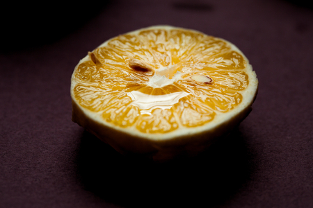 Fresh ripe lemons on Dark vintage background. Dark n Moody style macro lenseの写真素材