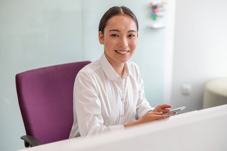 Asian woman working in IT officeの写真素材