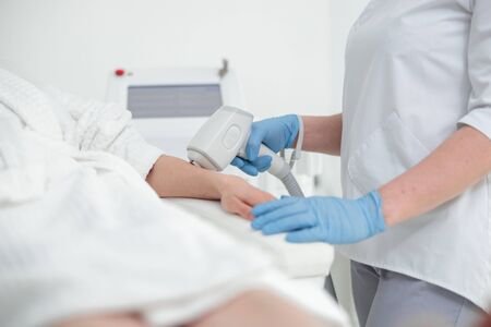 Woman takes care about her skin and doing cosmetology and lazer procedures