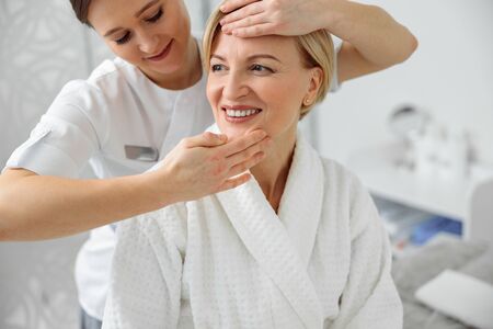 Woman takes care about her skin and doing cosmetology and lazer proceduresの写真素材